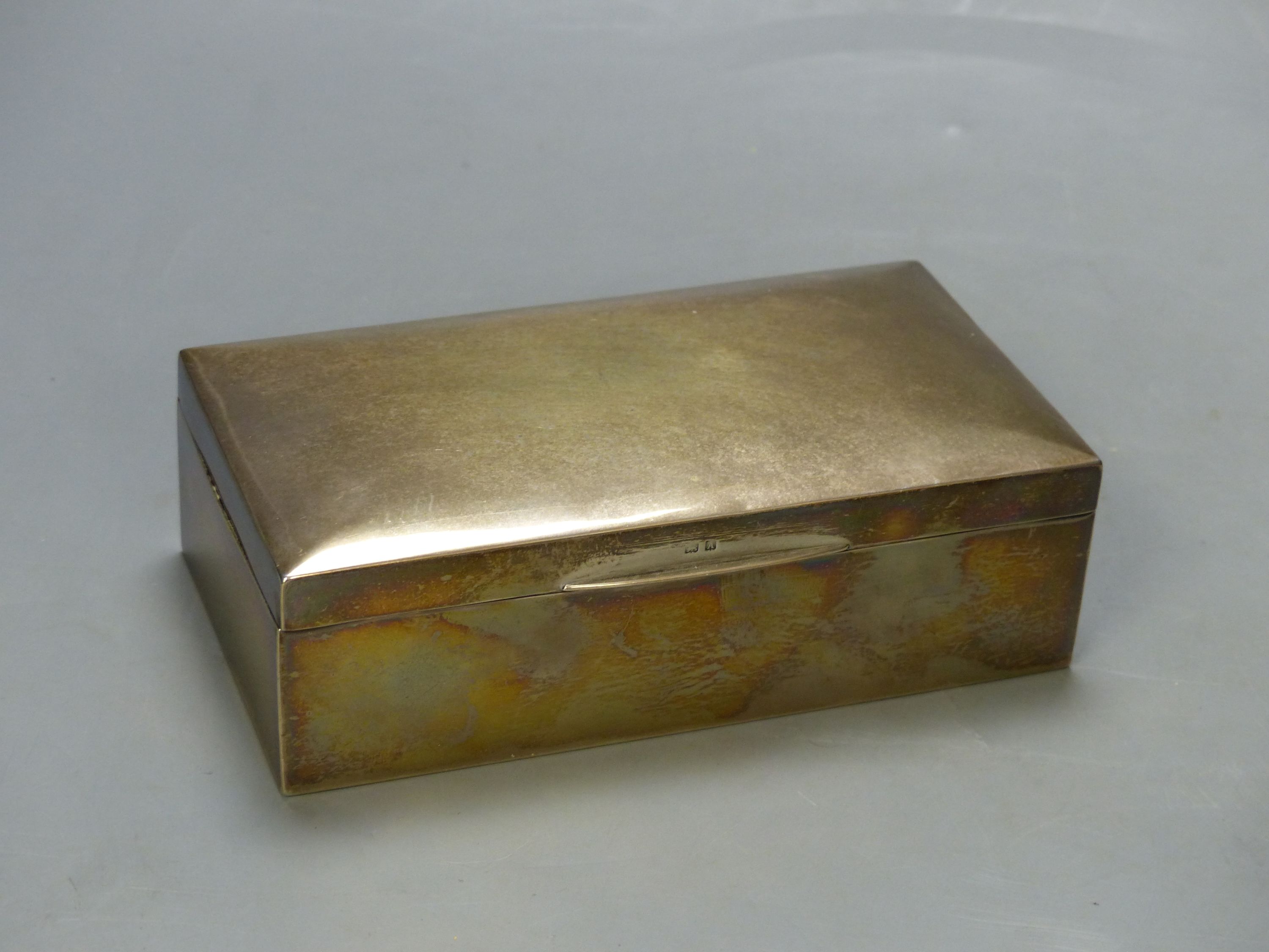 A George V silver mounted rectangular cigarette box, Birmingham, 1925, 16.6cm.